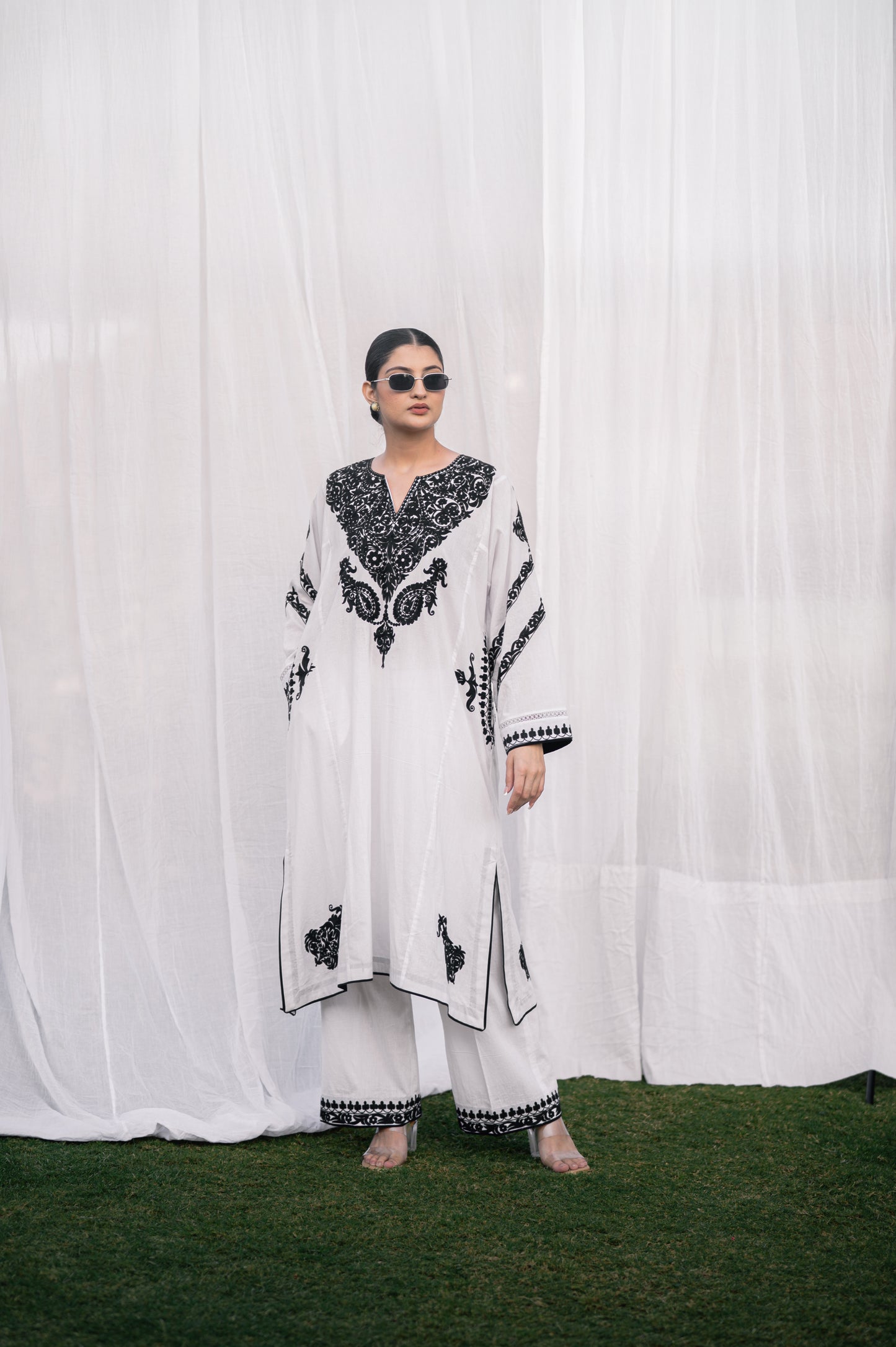 White mulmul phiran set with black aari embroidery