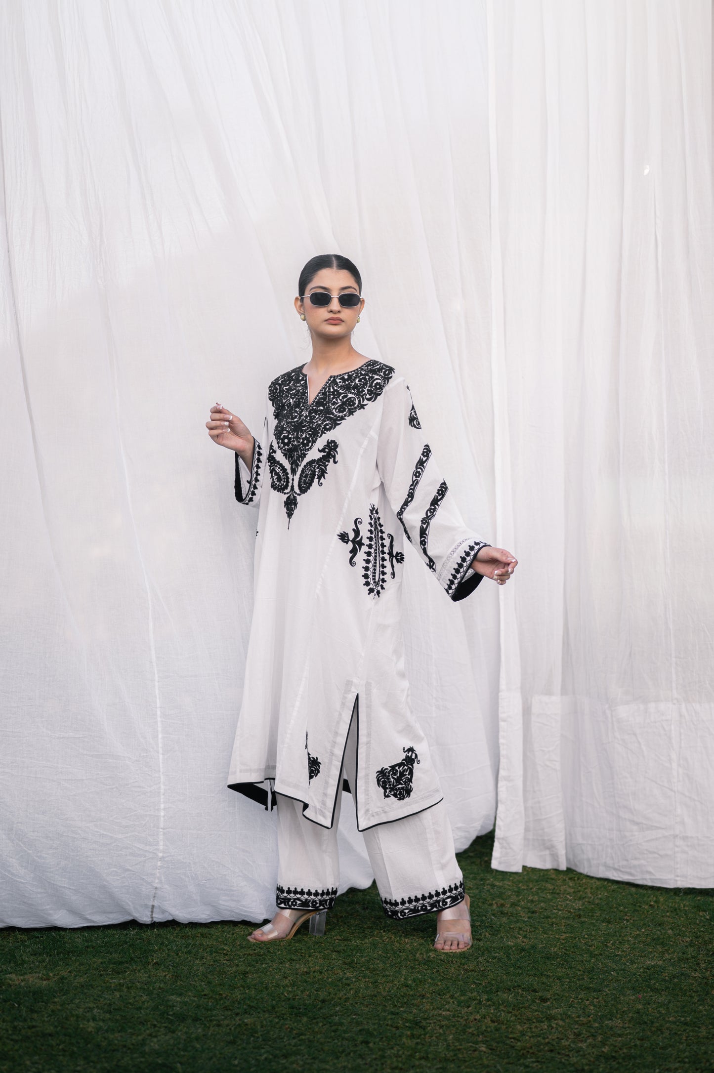 White mulmul phiran set with black aari embroidery