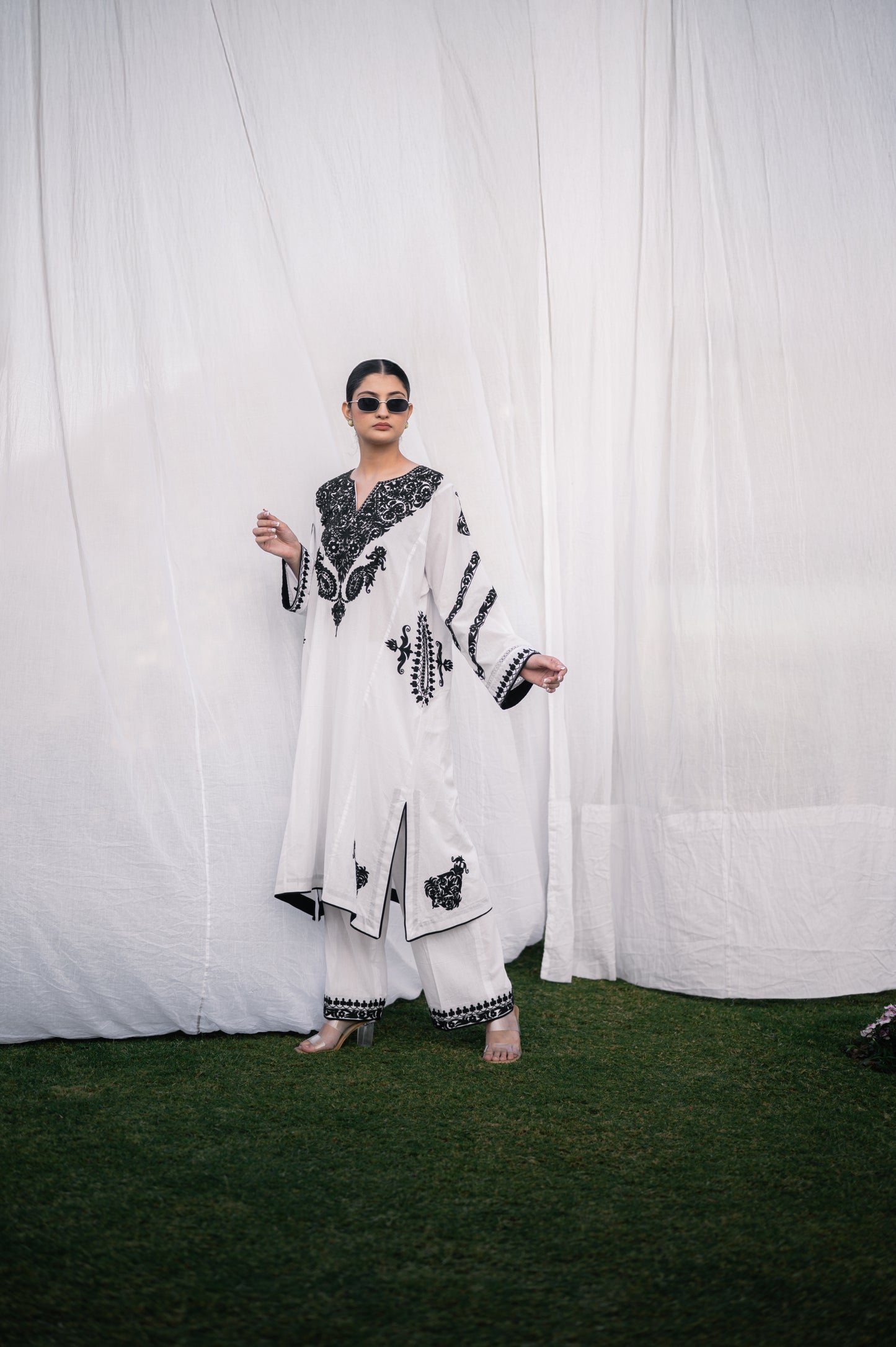 White mulmul phiran set with black aari embroidery