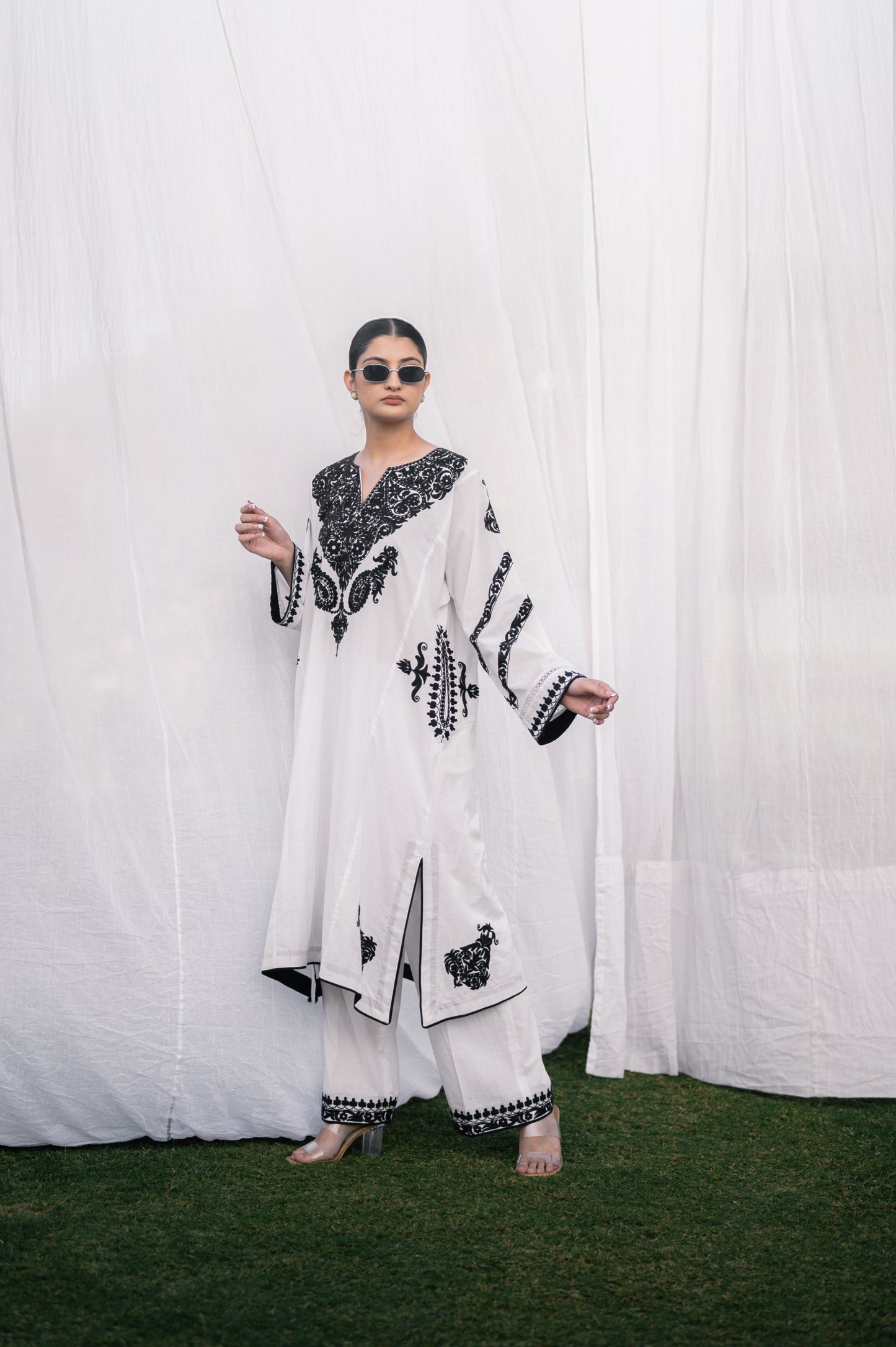 White mulmul phiran set with black aari embroidery