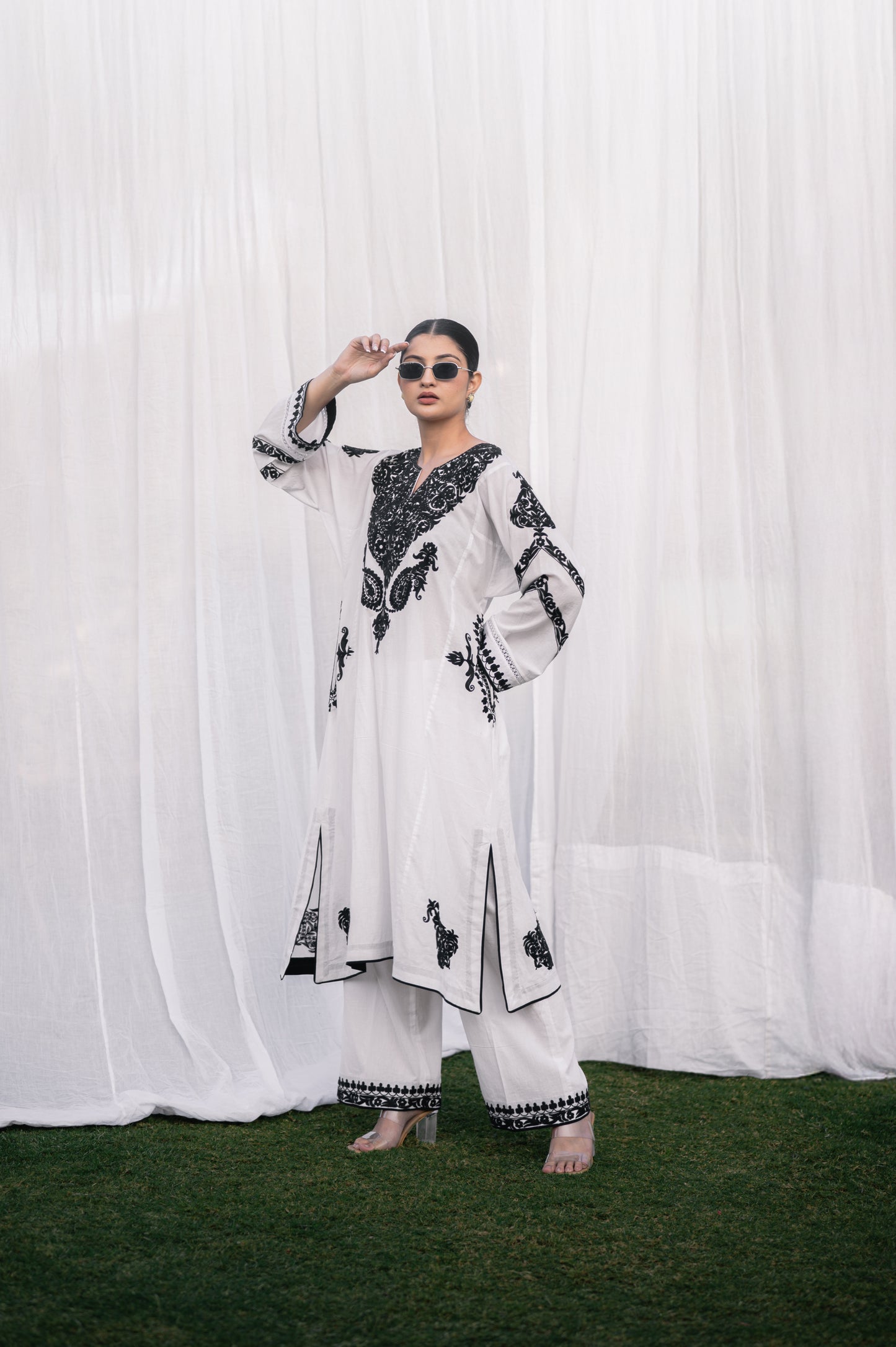 White mulmul phiran set with black aari embroidery