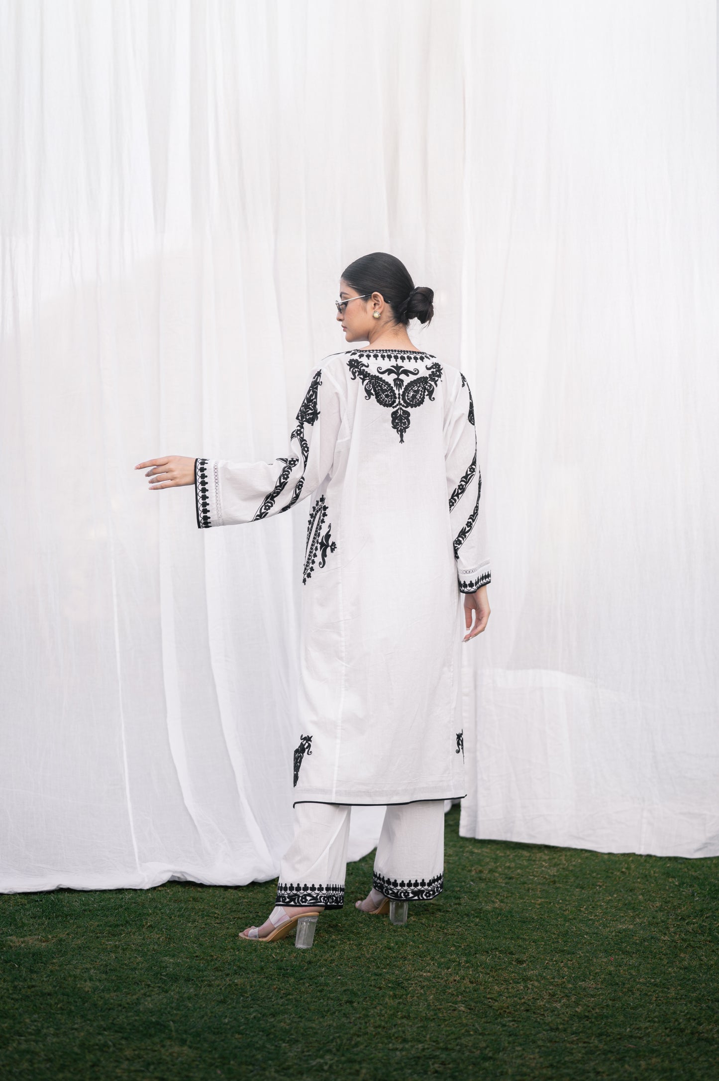 White mulmul phiran set with black aari embroidery