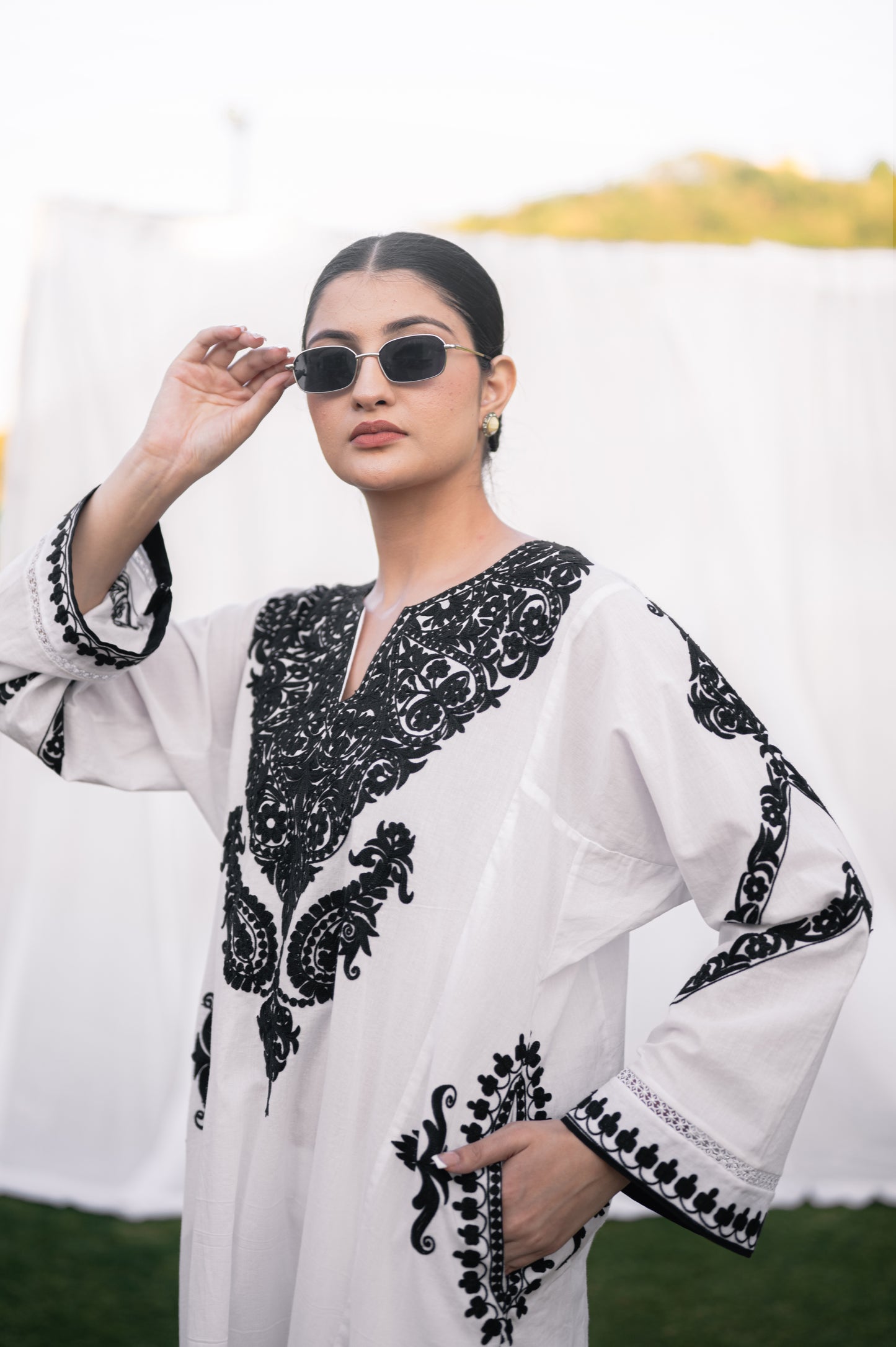 White mulmul phiran set with black aari embroidery