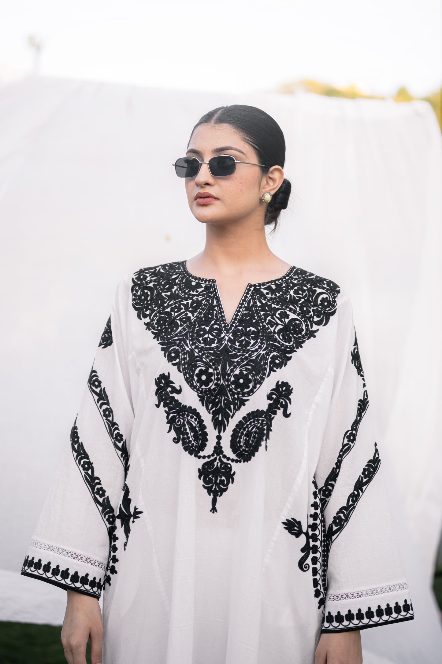 White mulmul phiran set with black aari embroidery