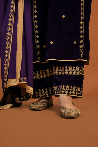Dark purple velvet aari tilla suit with potli